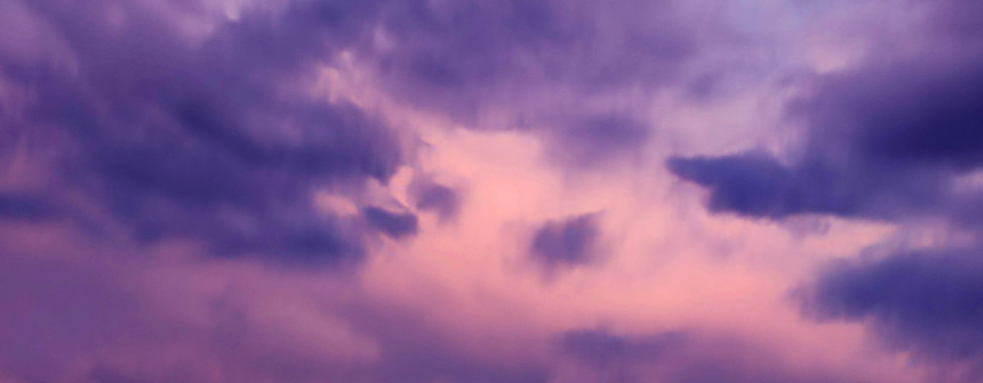 Image of purple tinged clouds. 